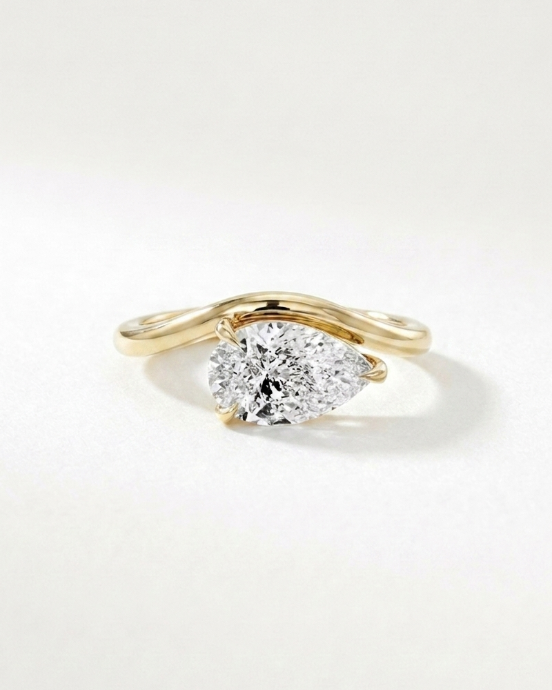 Zirconia Pear Cut Curved Ring